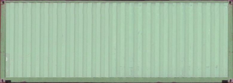 A green wall with many lines on it